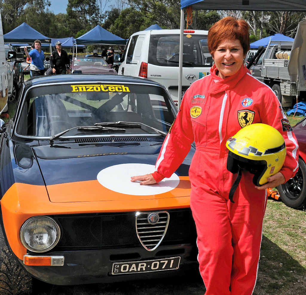 PRETTY IN PINK: Sunshine Beach resident Pip Covell with her Alfa Romeo GT Junior. PRETTY IN PINK: Sunshine Beach resident Pip Covell with her Alfa Romeo GT Junior.